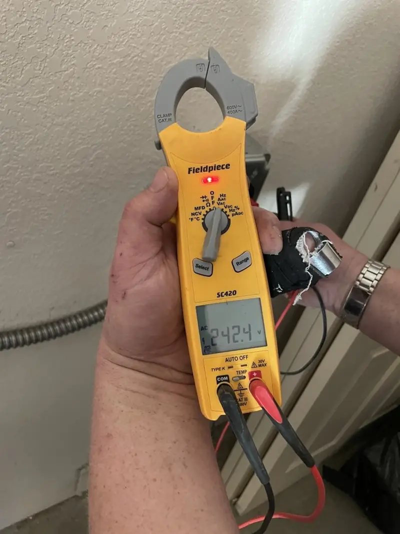 Voltage testing with clamp meter during Aluminum Wiring Replacement in Woodstock